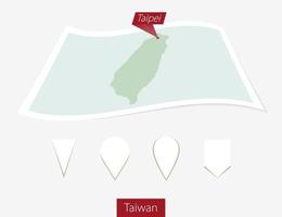 curvo papel mapa de Taiwán con capital taipei en gris antecedentes. cuatro diferente mapa alfiler colocar. vector