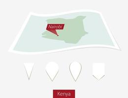 curvo papel mapa de Kenia con capital Nairobi en gris antecedentes. cuatro diferente mapa alfiler colocar. vector