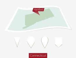 Curved paper map of Connecticut state with capital Hartford on Gray Background. Four different Map pin set. vector