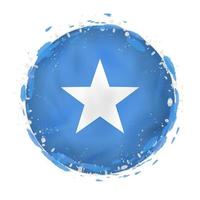 Round grunge flag of Somalia with splashes in flag color. vector