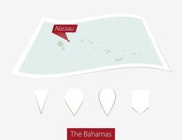 curvo papel mapa de el bahamas con capital Nassau en gris antecedentes. cuatro diferente mapa alfiler colocar. vector