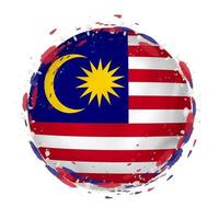 Round grunge flag of Malaysia with splashes in flag color. vector