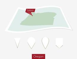 Curved paper map of Oregon state with capital Salem on Gray Background. Four different Map pin set. vector