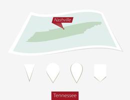 Curved paper map of Tennessee state with capital Nashville on Gray Background. Four different Map pin set. vector