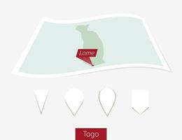 Curved paper map of Togo with capital Lome on Gray Background. Four different Map pin set. vector