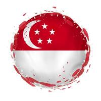 Round grunge flag of Singapore with splashes in flag color. vector