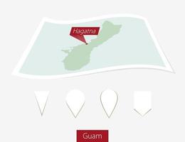 Curved paper map of Guam with capital Hagatna on Gray Background. Four different Map pin set. vector