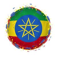 Round grunge flag of Ethiopia with splashes in flag color. vector