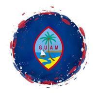 Round grunge flag of Guam with splashes in flag color. vector