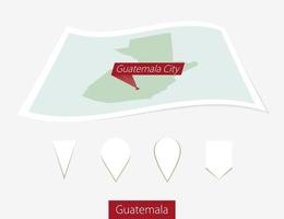 Curved paper map of Guatemala with capital Guatemala City on Gray Background. Four different Map pin set. vector