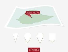 Curved paper map of Ethiopia with capital Addis Ababa on Gray Background. Four different Map pin set. vector