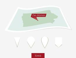 Curved paper map of Iowa state with capital Des Moines on Gray Background. Four different Map pin set. vector