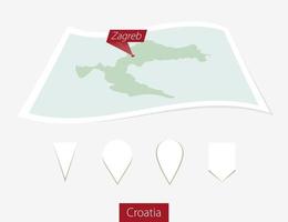 Curved paper map of Croatia with capital Zagreb on Gray Background. Four different Map pin set. vector