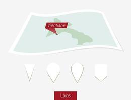 Curved paper map of Laos with capital Vientiane on Gray Background. Four different Map pin set. vector