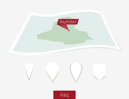 Curved paper map of Iraq with capital Baghdad on Gray Background. Four different Map pin set. vector