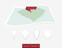 Curved paper map of South Carolina state with capital Columbia on Gray Background. Four different Map pin set. vector