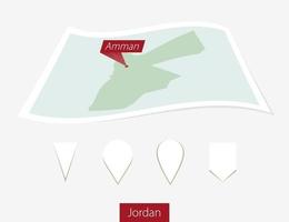 Curved paper map of Jordan with capital Amman on Gray Background. Four different Map pin set. vector