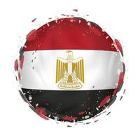 Round grunge flag of Egypt with splashes in flag color. vector