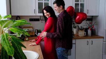 Man and woman in love date at home in kitchen happy hugs. Valentine's Day, happy couple, love story. Love nest, housing for young family video