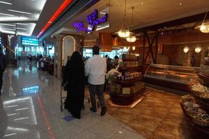 DUBAI, UAE - SEPTEMBER 4 2017 - Travellers at Dubai Airport photo