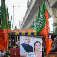 Delhi, India, December 02 2022 -Bharatiya Janata Party BJP supporter during mega road show in support of BJP candidate Pankaj Luthara to file nomination papers ahead of MCD local body Elections 2022 photo