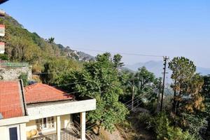 Early morning view of Modern rooftop restaurant at Kasauli, Himachal Pradesh in India, View of mountain hills from open air restaurant in Kasauli, Kasauli Rooftop restaurant photo