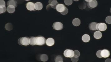 glittering lights. defocused light circle bokeh video