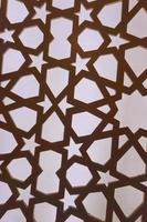 Silhouette of laser cut template panel with grey light. Arabian ornamental panel set. Silhouette or backlight ornament for background. photo