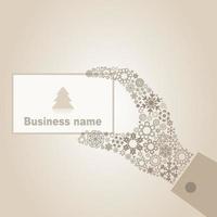 The hand from snowflakes holds business a card. A vector illustration