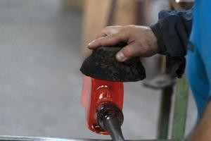 glass master while working in Murano furnace glass factory Venice Italy photo