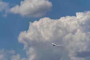 airplane after taking off on the clouds photo