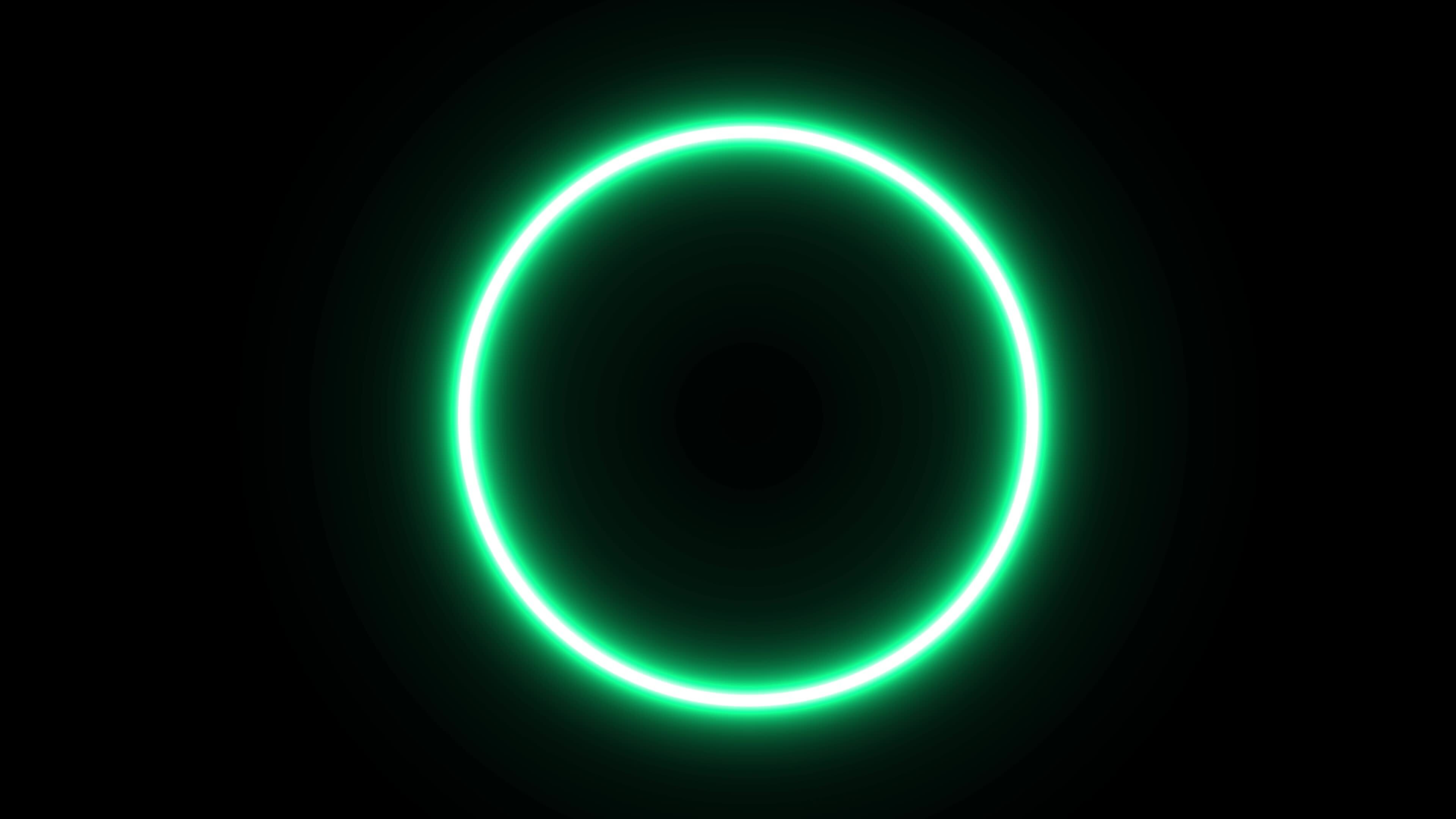 Animated green slowly flashing neon circle on black background
