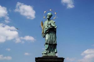 Prague charles bridge detail of statue photo