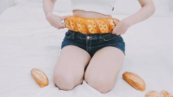 Slender girl eats healthy food, Fat woman eats harmful fast food. On a white background, the theme of diet and proper nutrition, choice and opposition. video