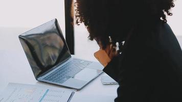 Financial analysts analyze business financial reports on a digital tablet planning investment project during a discussion at a meeting of corporate showing the results of their successful teamwork. video