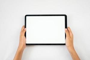 hands holding tablet blank screen horizontally photo