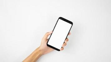 hands holding smartphone tilted  isolated for mockups photo