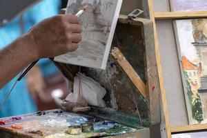 artist painter palette while painting in prague photo