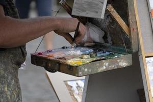 artist painter palette while painting in prague photo