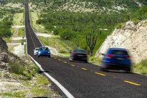 Baja California desert endless road landscape view with tunning cars photo