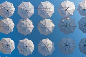 many white umbrellas in the sky photo