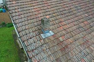 italiy tile roof chimney detail drone view photo