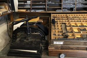 Old ancient print machine hand press photo