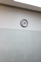 clock on wall of empty office photo