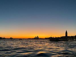 water surface of Venetian lagoon at sunset photo