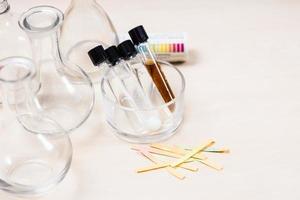 test tubes with solutions, flasks and indicators photo