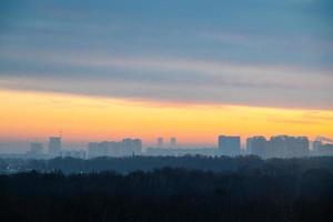 early winter cold dawn over park and city photo