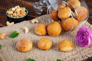 Butter cookies on wooden background. Delicious honey gingerbread photo