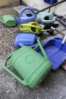 Colored plastic watering cans photo