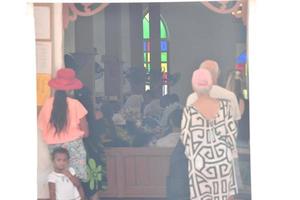 AITUTAKI, COOK ISLAND - AUGUST, 27 2017 - Local people at the mass photo